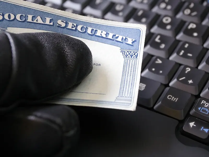 hand holding social security card
